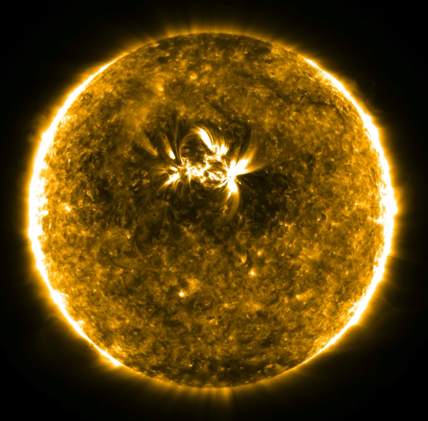 Dark halos around active regions in the solar atmosphere